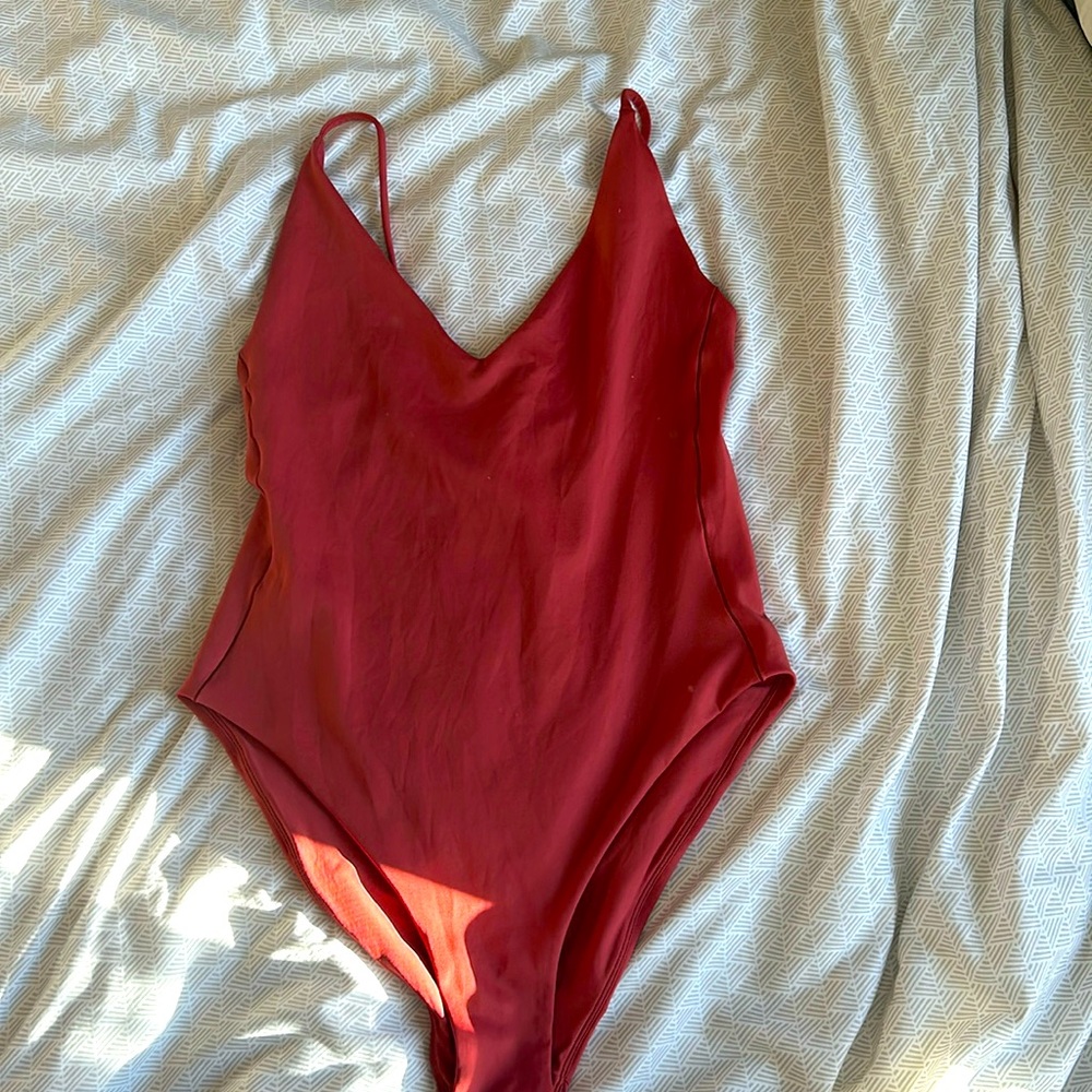 Left on Friday coral one piece bathing suit